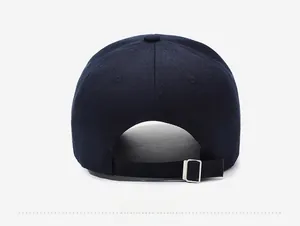 Detail view of the navy cotton baseball cap showing adjustable silver metal buckle at the back