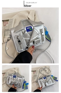 Detail of silver biker jacket crossbody bag with metallic studs and zip accents