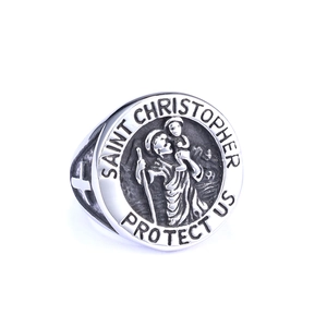 Macro view of vintage Saint Christopher protect us engraving on stainless steel ring