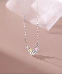 Detail of S925 silver butterfly necklace with colorful pear-cut zircon wing stones