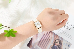 Elegant ladies quartz watch with rectangular rose gold case on a white leather strap
