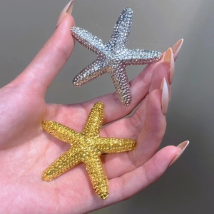 Starfish brooches in gold and silver finish with sparkling rhinestones for coats