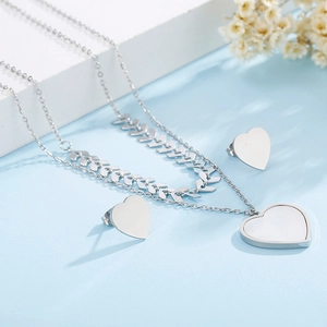 Silver double-layer wheat chain necklace with heart shell pendant and matching stud earrings