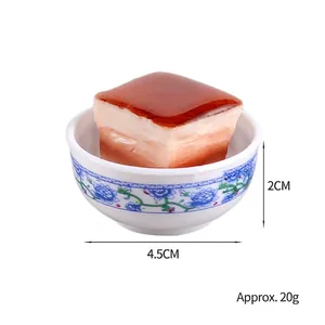 Miniature braised pork food model in a blue and white porcelain bowl, 4.5cm diameter