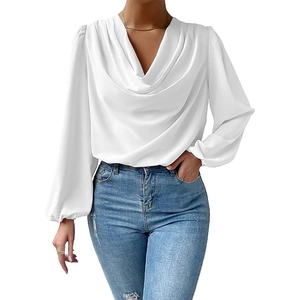 Detail of white chiffon blouse showing elegant draped V-neckline and soft fabric texture