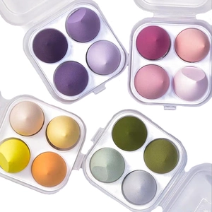 Set of 4 makeup sponge boxes with colorful beauty blenders in transparent storage cases