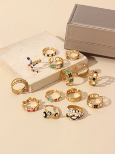 Detailed set of 13 gold-plated rings with colorful enamel heart and snake motifs
