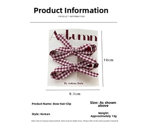 Detail view of red plaid bow hair clips on display card with dimensions 10cm x 9.1cm