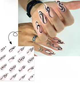 Detail of long almond press-on nails featuring black snake skin patterns on nude pink base