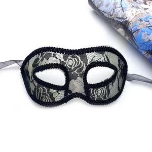 Elegant black lace masquerade mask with intricate rose patterns and side ribbon ties