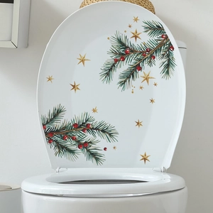 Self-adhesive Christmas toilet lid sticker featuring green pine branches and gold stars