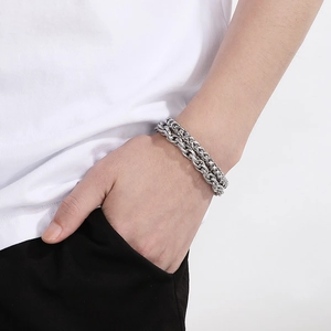 Close-up of men's double-layer stainless steel wheat chain bracelet on wrist