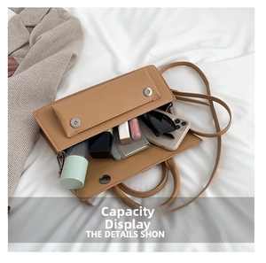 Top view of khaki faux leather handbag interior showing large storage capacity for daily items