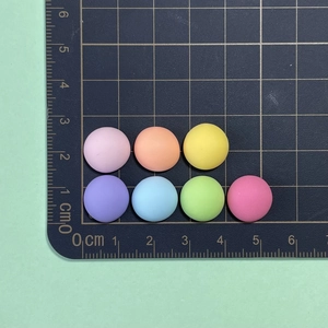 Macro view of 1.5cm colorful resin donut charms for DIY nail art and hair clips