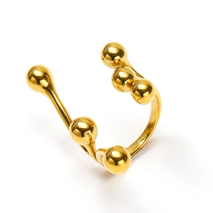 Detail of 18k gold plated stainless steel ring with multiple polished metal spheres