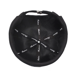 Overhead view of black cotton docker hat with fashion embroidery and metal buckle