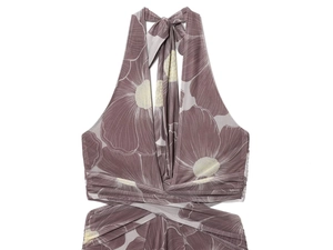Detail of mauve floral mesh dress featuring large white flowers and a halter neckline