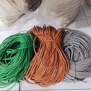 Close-up of 6mm round PU leather cords in green, brown, and gray for DIY bag handles