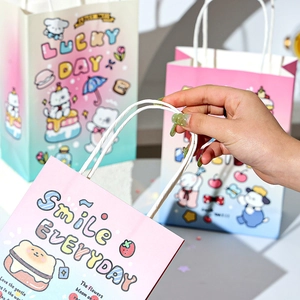 Detail of cute cartoon animal kraft paper gift bags with handles for birthday party candy