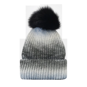 Bonnet en tricot dégradé bleu et blanc pour femme avec grand pompon en fausse fourrure