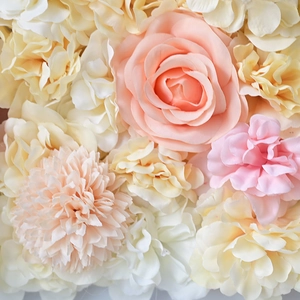 Close-up of artificial rose and hydrangea flower wall in champagne and pink tones