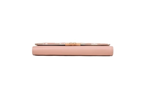 Detail of light pink long wallet showing stitching, floral decor and gold metal clasp