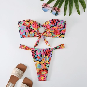 Detail of floral bandeau bikini top with decorative center ring and matching high-cut bottoms