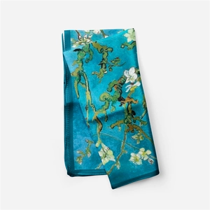 Detail of silk scarf featuring Monet Water Lilies and almond blossom art patterns