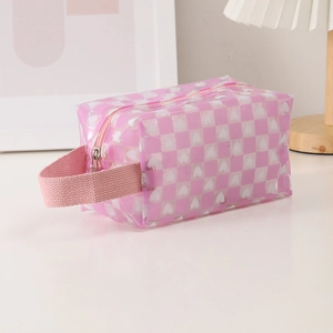 Pink checkered PVC pencil case with white heart patterns and a portable hand strap