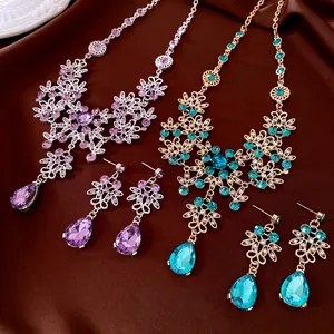 Elegant floral necklace and earring jewelry set with purple and blue teardrop crystals
