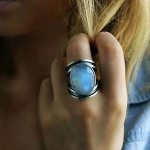 Retro wide band moonstone ring with a vintage oval blue gemstone and silver finish