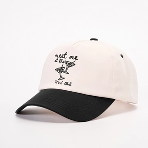 Detailed embroidery of meet me at the Tini Club text and martini glasses on baseball cap