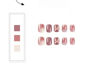 Detail set of pink press-on nails with cat eye finish, 3D bows, and pearl accents