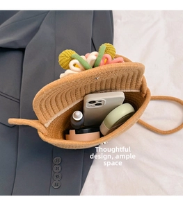 Detail view of woven straw bucket bag interior showing spacious storage for essentials