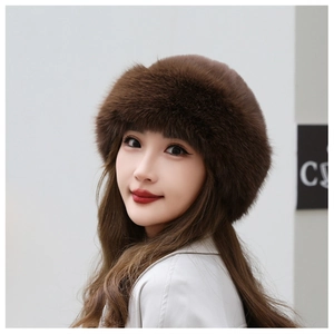 Detailed texture of thick dark brown faux fur on a warm winter Mongolian style hat