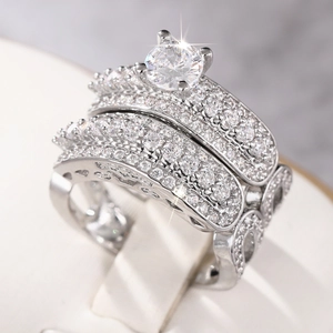 Three-piece stackable wedding ring set with micro-paved zircons and a four-claw center stone