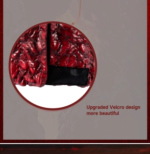Close-up of upgraded black Velcro strap on red textured Halloween devil mask material