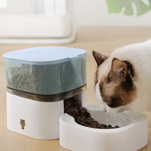 Automatic gravity pet feeder with translucent blue grain storage and white food bowl