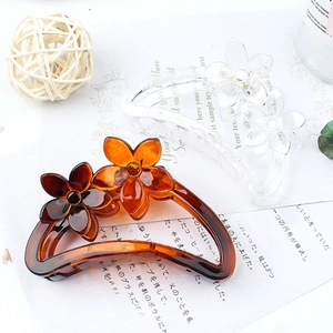 Elegant floral resin hair claw clips in amber and clear colors for stylish hairstyles