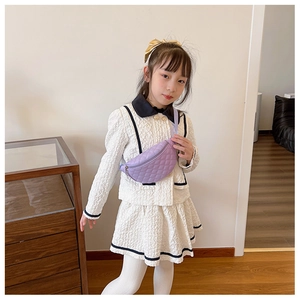 Close-up of quilted purple PU leather chest bag with zipper and adjustable strap