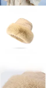 Detail view of winter beige quilted bucket hat with fluffy faux fur brim for wind protection