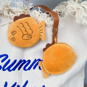 Detail of taiyaki plush coin purses featuring golden zippers and durable metal bead chains
