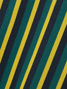 Macro texture of striped knit fabric in yellow, forest green, and navy blue tones