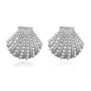 Detail of silver shell earrings with vertical stripes, white beads, and zircon accents