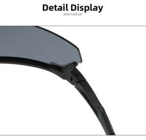 Detail shot of sturdy hinge structure and gray lenses on sports cycling sunglasses