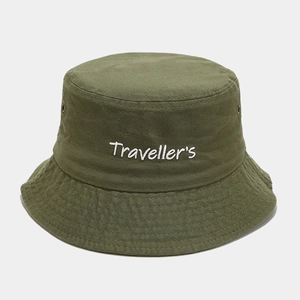 Detail of embroidered Traveller's text and metal eyelets on olive green cotton bucket hat