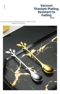 Macro detail of leaf-shaped stainless steel spoons in gold and silver with vacuum plating