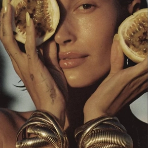 Hailey Bieber wearing a wide gold textured spiral elastic bangle in stainless steel