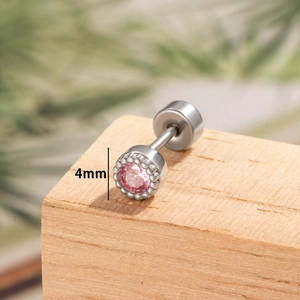 Minimalist geometric 4mm pink zircon silver cartilage earring on natural wooden display