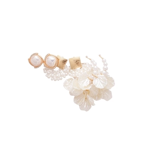 French vintage floral earring set with pearls and diamonds on a white background